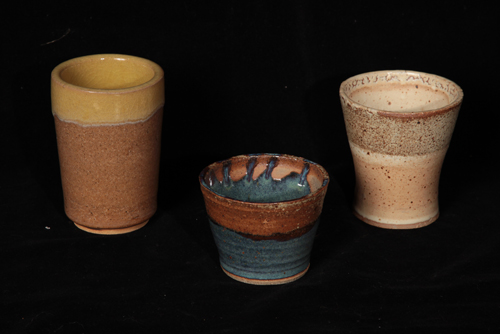 three cups with very different glazes
