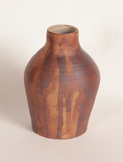 a vase glazed in varying densities of iron oxide