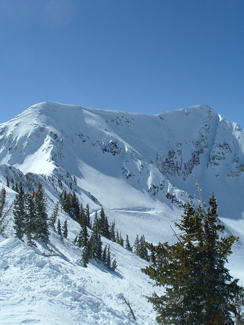 a snow covered rockey mountain ridge